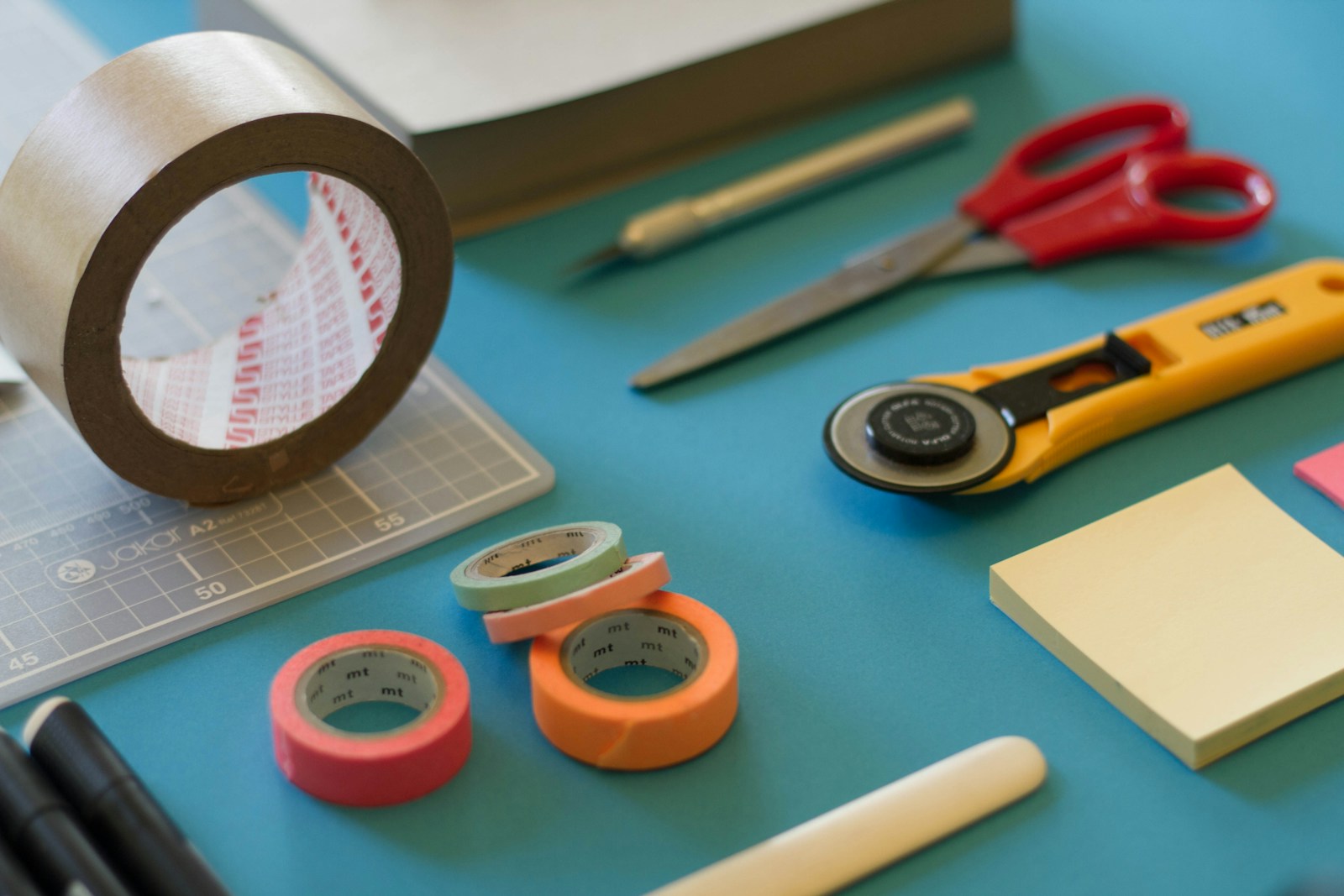 Creative worktable with tools, sketches and thoughtfully arranged materials
