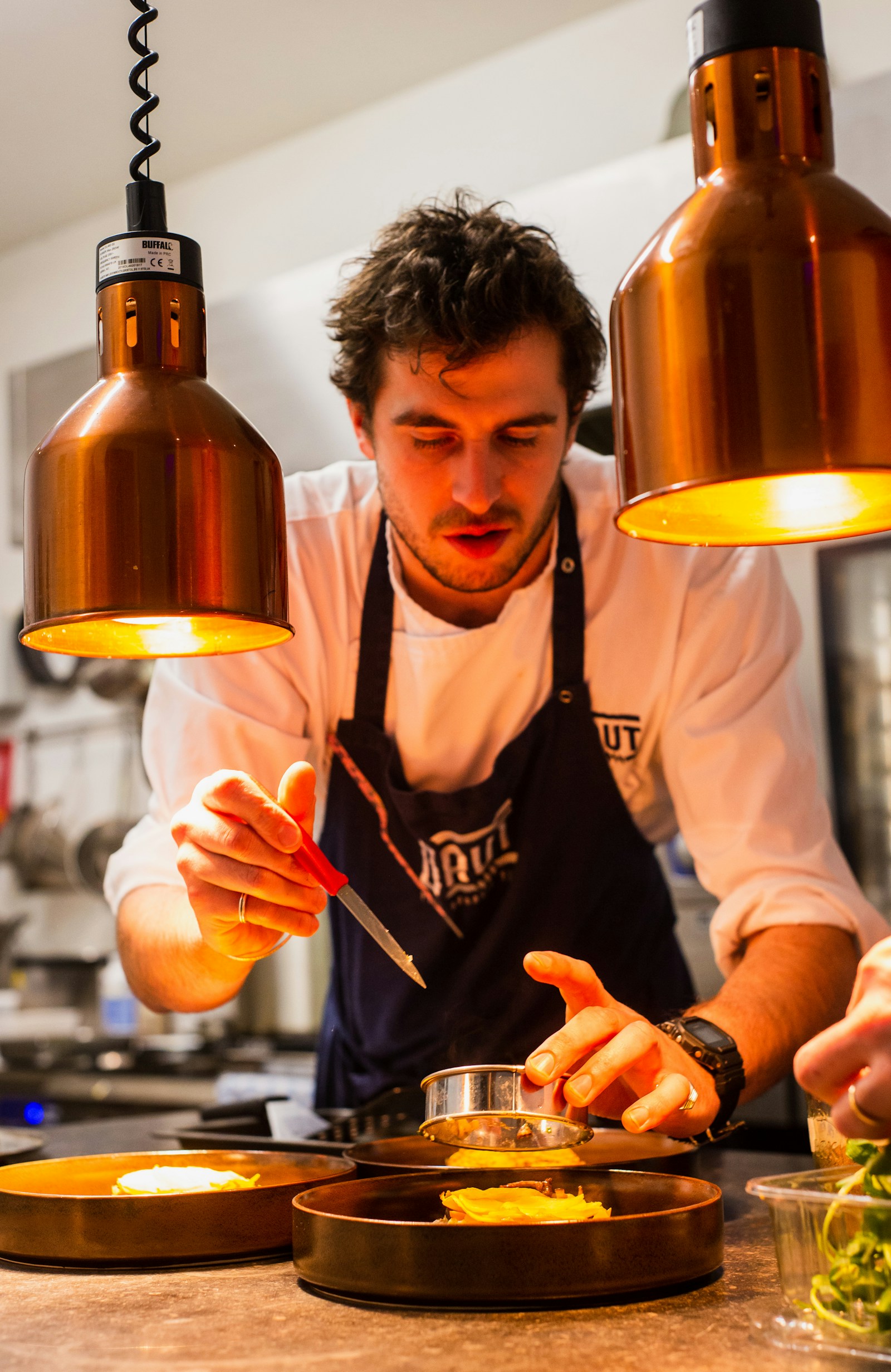 Chef working with care in a professional restaurant kitchen